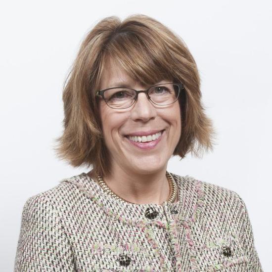 A woman poses for a professional photo.